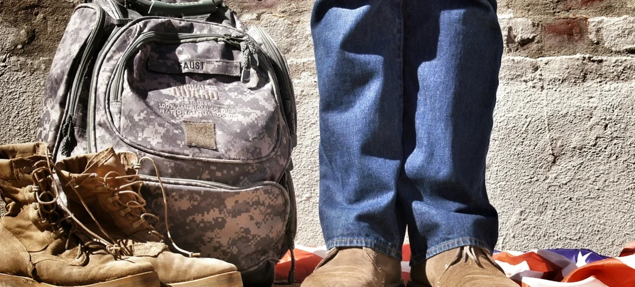 Veteran Law - Verteran with Backpack and Flag